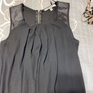 black tank with faux leather straps